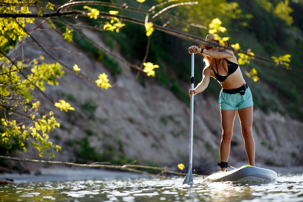 Paddling Stand-Up Paddle Board (SUP) near shore
